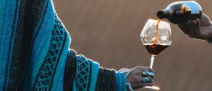 filling glass with wine